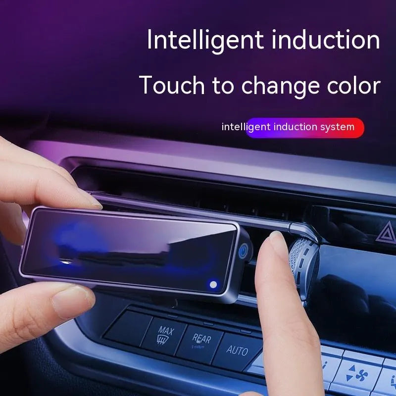 Black car air vent aromatherapy light with LED illumination and fragrance stick inserted