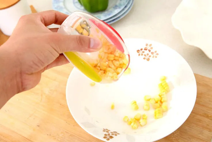 Kitchen corn separator with stainless steel blade and plastic shell for removing kernels from cobs