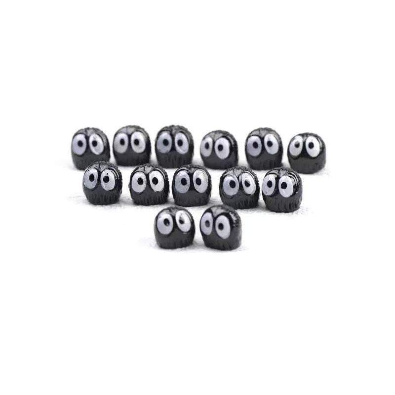 Small resin cartoon coal briquette decoration for car dashboard with traceless tape.
