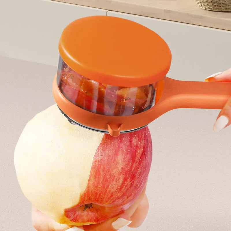 Light green kitchen peeler with attached storage bucket for catching fruit and vegetable peelings