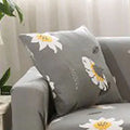 Geometric pattern stretchable sofa slipcover on three-seater sofa showing tight fit without wrinkles