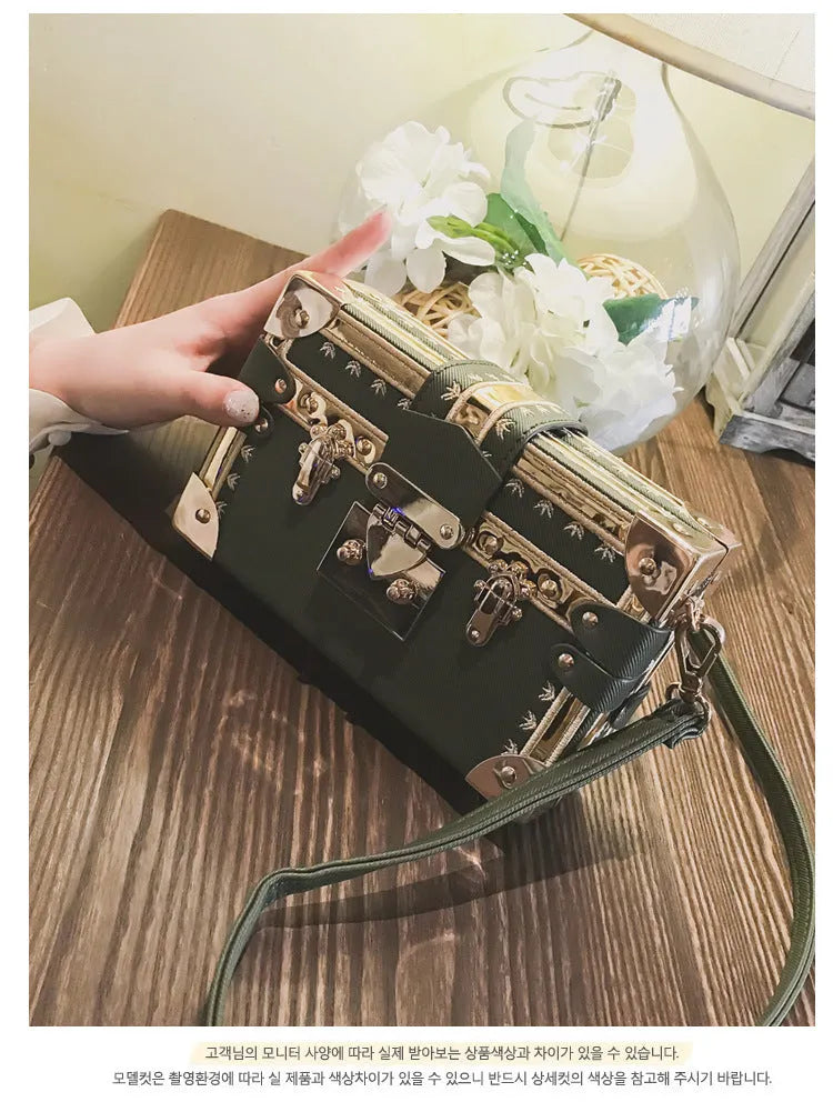 Women's hard PU shoulder bag with flap closure and single strap in black or green, showing rivet decoration