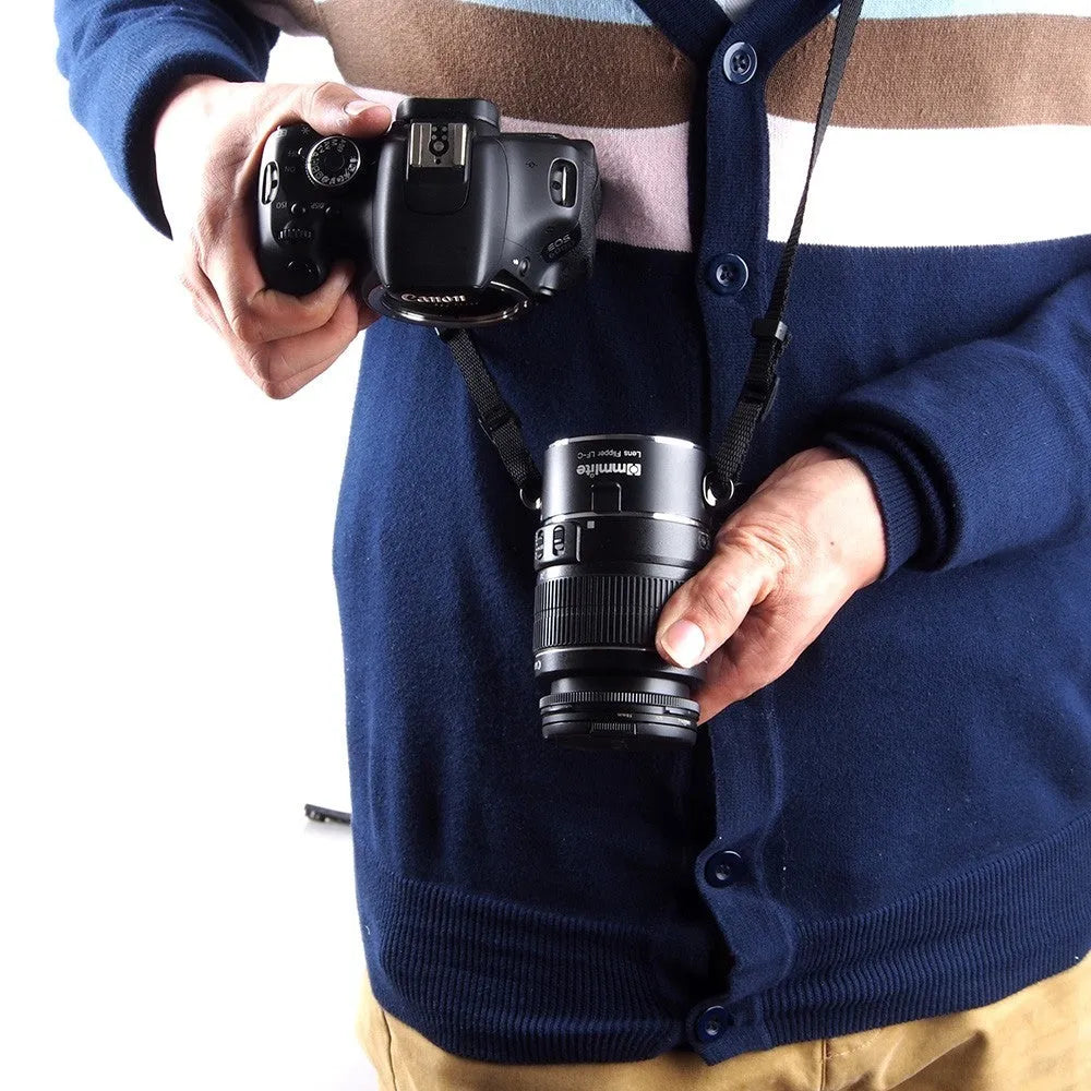 Aluminium alloy Nikon lens flipper holding two camera lenses with cotton shoulder strap