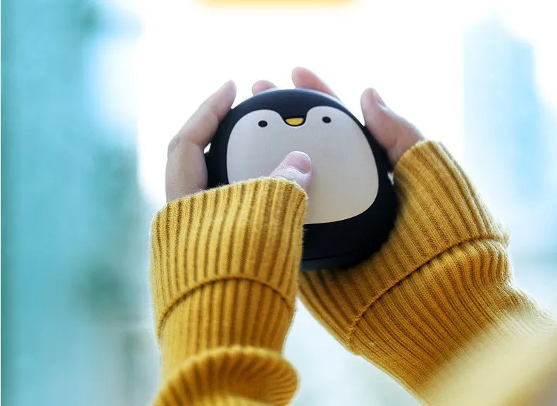 Cartoon penguin polar bear design USB hand warmer showing double-side heating and compact 83x78x35mm dimensions