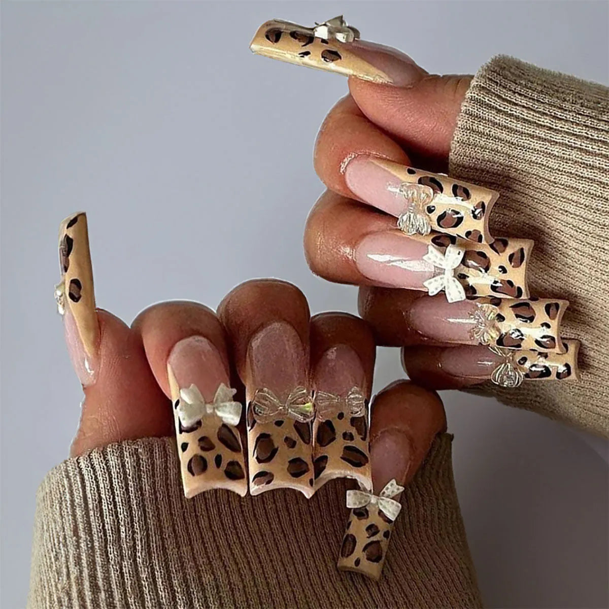 Leopard print butterfly nail art pieces with dimensional plastic construction in WM296 colour pattern