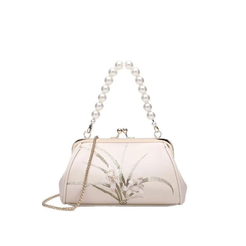 Beige women's embroidered shoulder bag with shell shape design in soft PU material