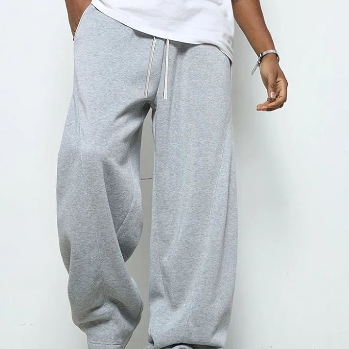 Men's straight leg casual trousers in polyester with micro-elastic waistband and drawstring closure, available in three colours.