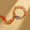 Handmade agate Tibetan bracelet with geometric flower patterns and lily elements in vintage ethnic style