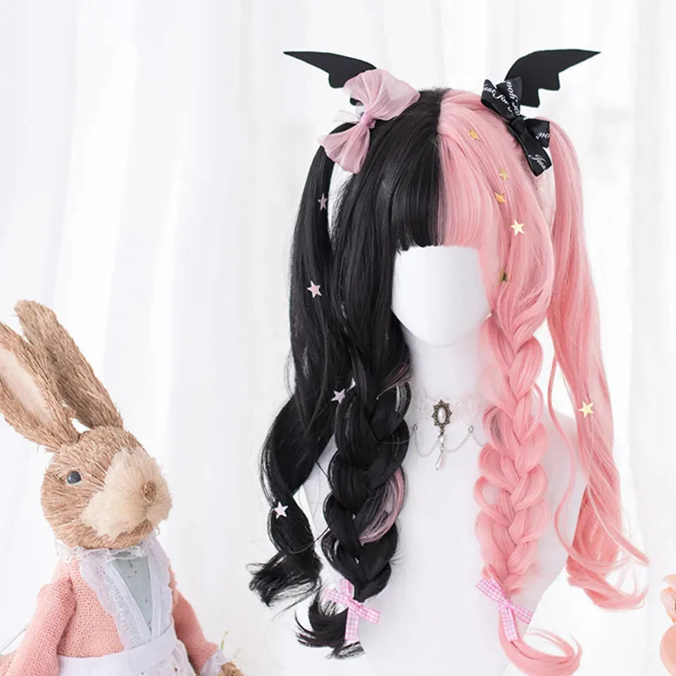 Harajuku Japanese Lolita long curly wig in black and pink colours with bangs on a wig stand.