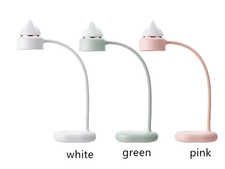 Green LED desk lamp with clip base and touch controls on a wooden desk surface