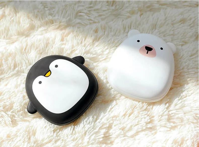 Cartoon penguin polar bear design USB hand warmer showing double-side heating and compact 83x78x35mm dimensions