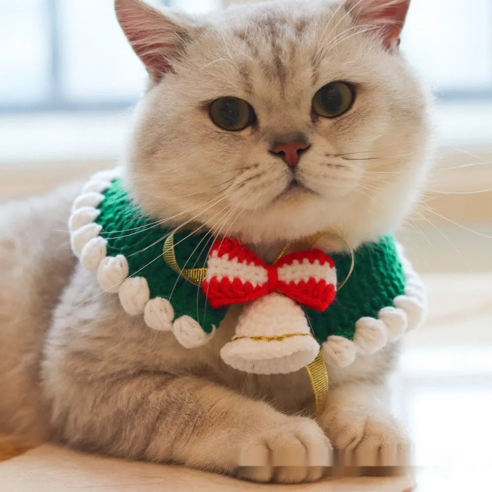 Knitted wool Christmas scarf for a small dog featuring a striped Santa Claus pattern.