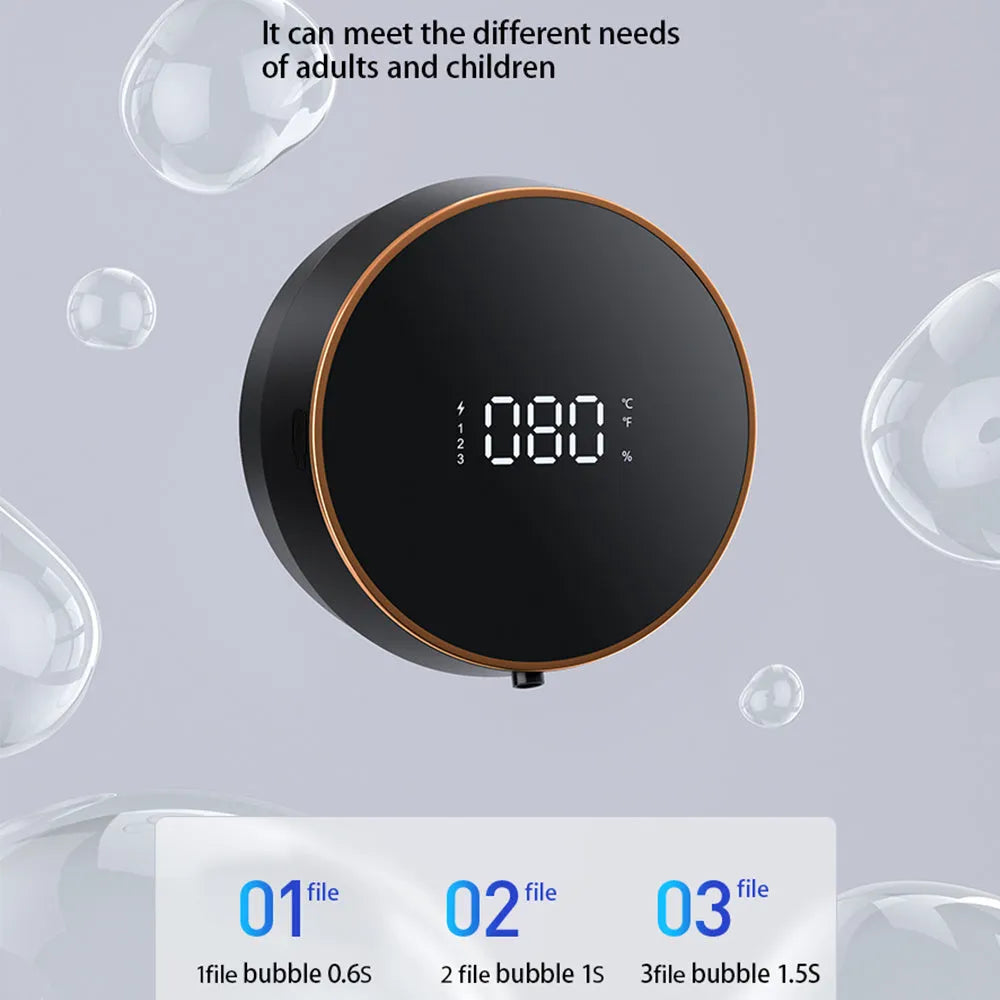 Black smart sensing foam dispenser mounted on wall with USB cable, showing sensor activation for touch-free hand cleaning