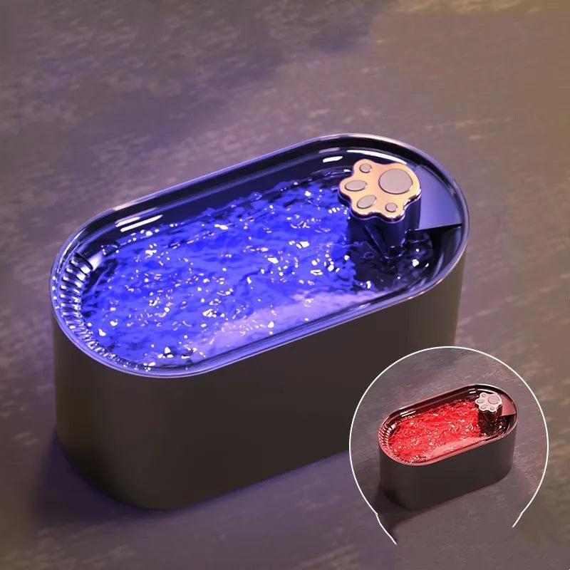 Berlin blue automatic cat water fountain with filter, LED light, and 3L capacity on a kitchen floor.