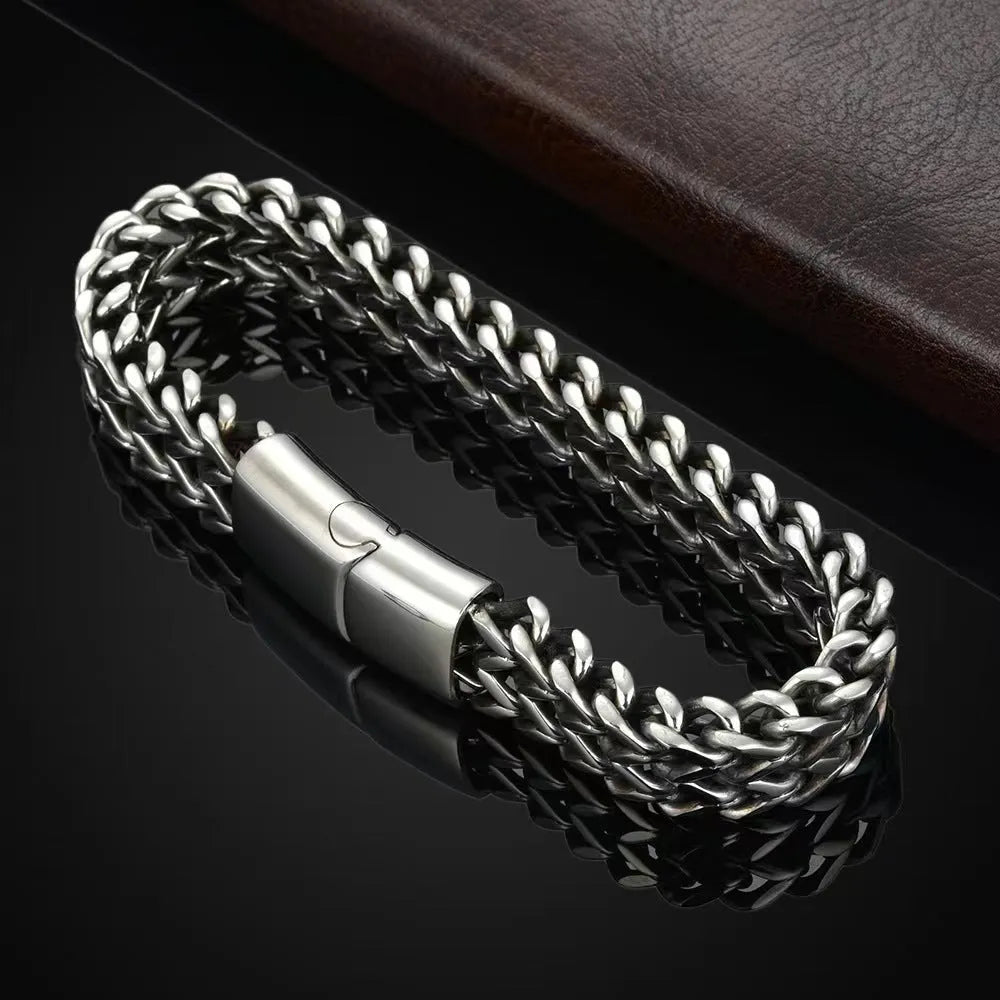 Silver titanium steel men's hip hop bracelet with geometric beads on a wrist.