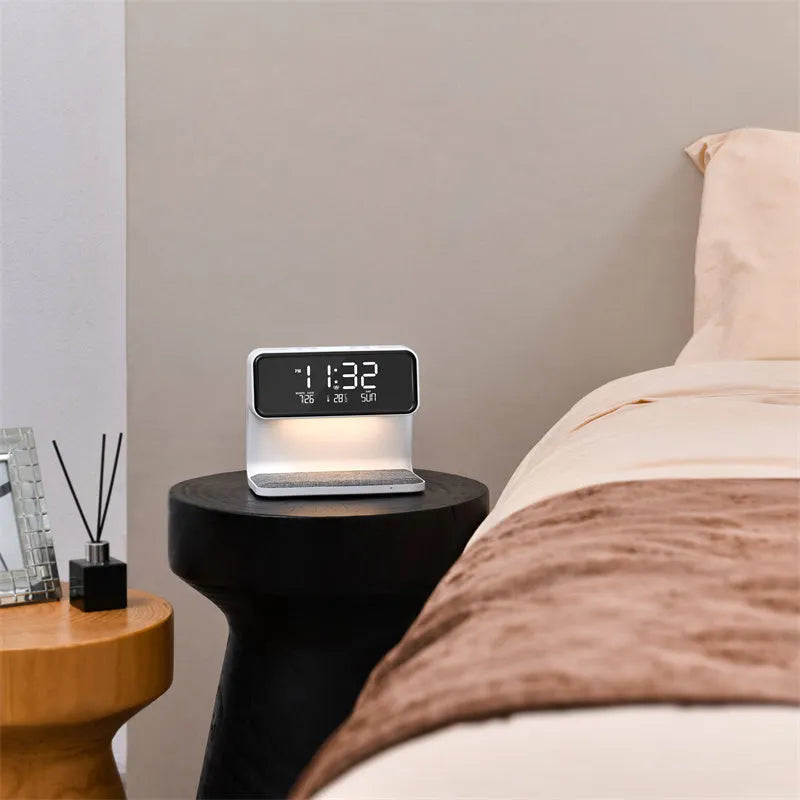 White bedside lamp with integrated wireless charging pad, LCD alarm clock screen, and touch-sensitive dimming controls.