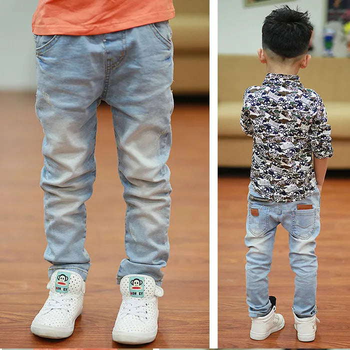 Boy wearing striped denim harem pants with an elasticated waistband, casual style for spring and autumn.