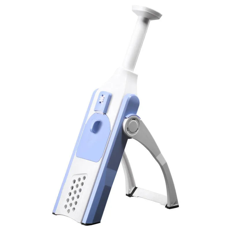 White and blue multifunctional vegetable slicer with stainless steel blades on kitchen counter
