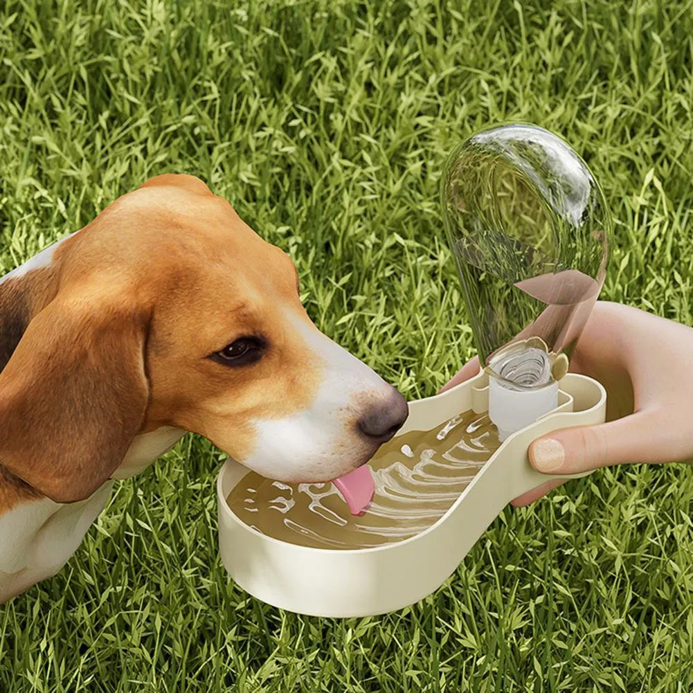 Orange and white portable pet water bottle with attached food container for dogs and cats