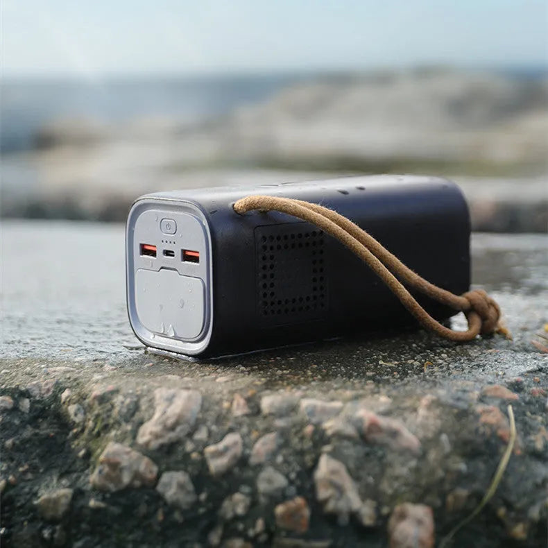 Black portable power bank with solar panel, 70mm width, showing USB ports and power indicator lights