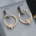 A pair of round geometric hoop earrings for women made from electroplated copper.