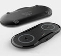 Black and white dual 10W wireless charger charging two phones simultaneously on silicone anti-slip base