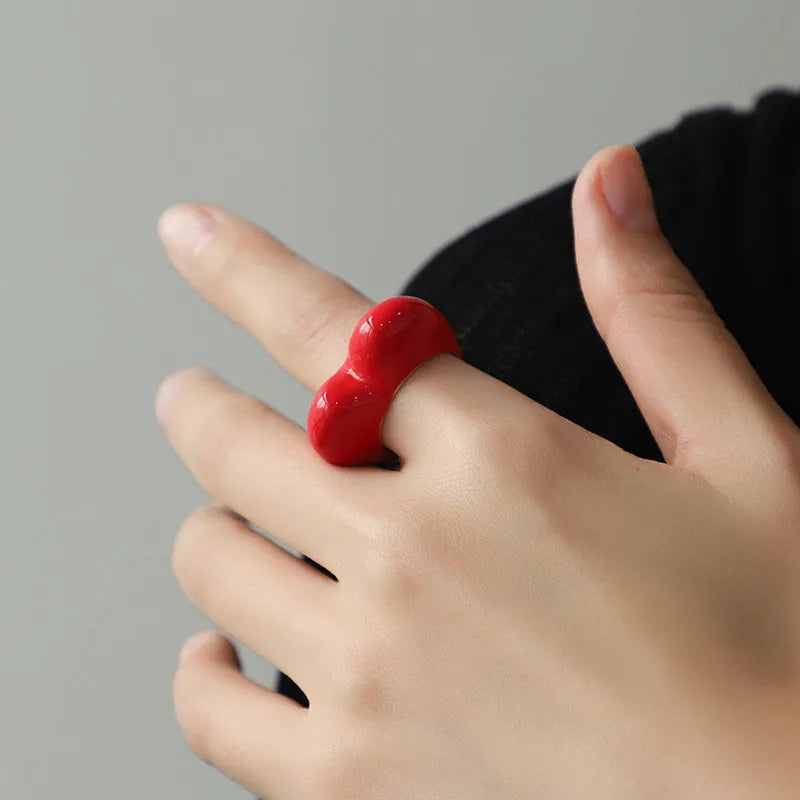 Three-dimensional heart-shaped enamel ring in black, pink, purple, or red colour, made from zinc alloy, sized 17 or 18.