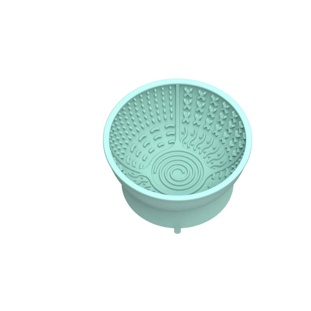 Cyan silicone dog bowl with textured feeding surface and suction cup base, measuring 15.8cm across