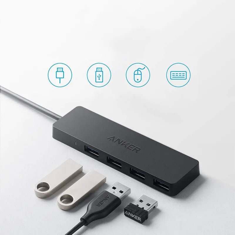 Black Anker USB 3.0 hub with four ports and a 20cm cable on a desk.