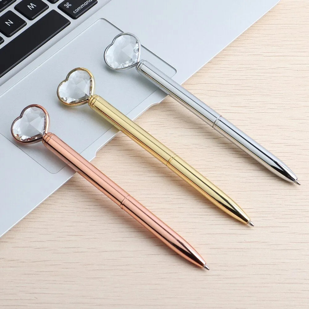 Golden Love Ball Crystal Diamond Metal Pen on a white background.