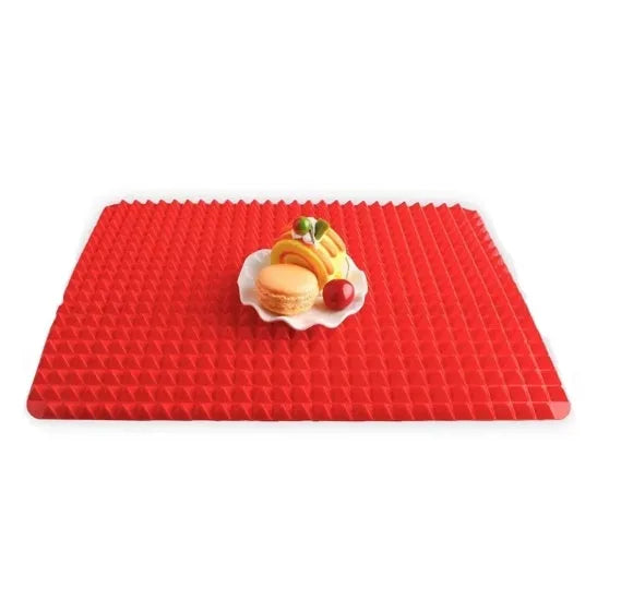 Red silicone pyramid cooking mat with grid pattern for oven and BBQ use