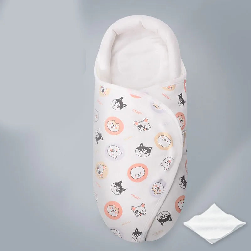 Cotton anti startle baby swaddle in a colourful pattern, laid flat showing its 30x60cm size.