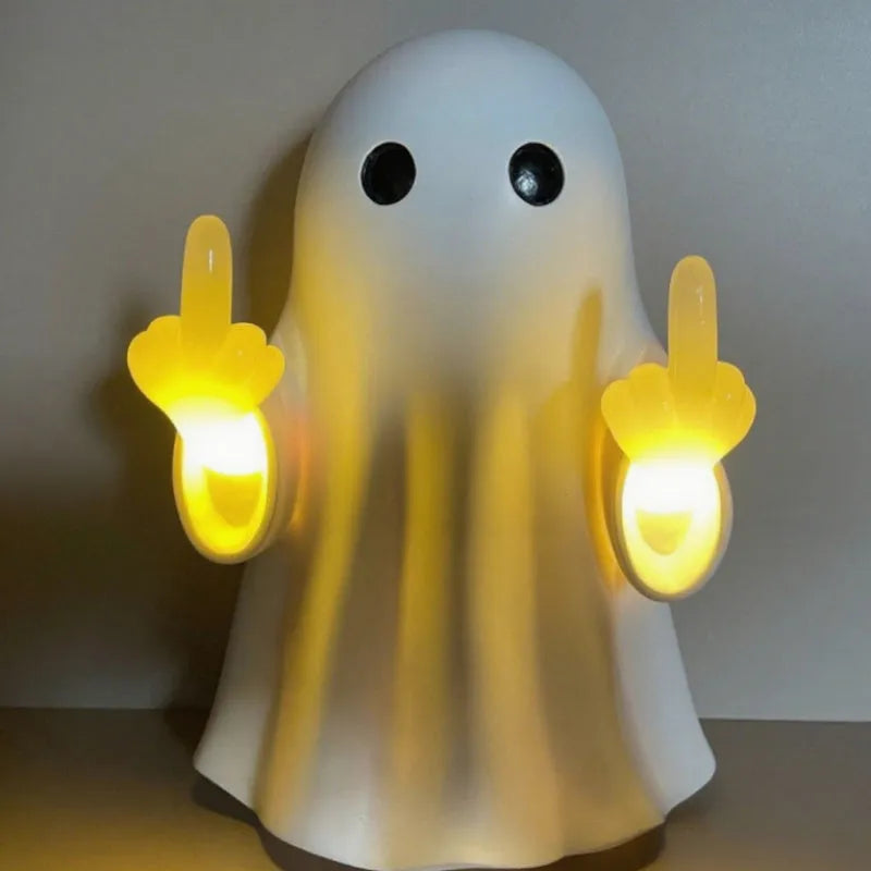 White ghost-shaped night lamp on table with soft glow, measuring 19.85cm tall for Halloween decor