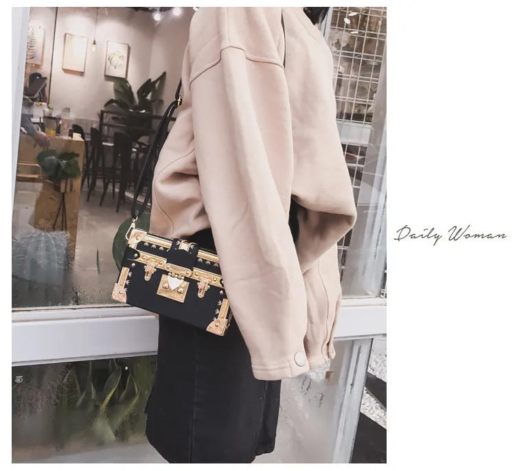 Women's hard PU shoulder bag with flap closure and single strap in black or green, showing rivet decoration