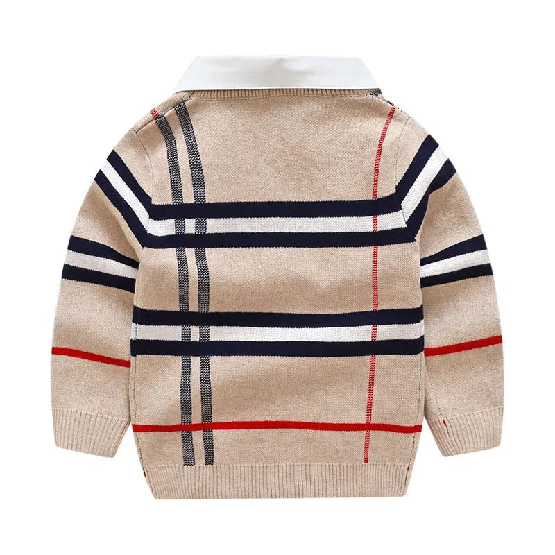 Boy's apricot and navy blue plaid jacquard cotton sweater with long sleeves on a hanger