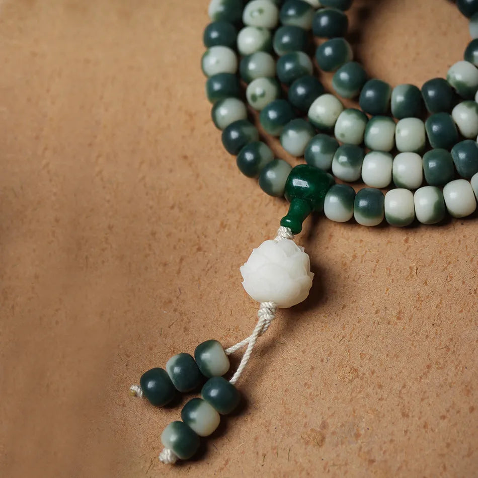 Lotus white jade bodhi beads bracelet with carved floral patterns on 8mm jade beads