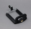 Black octopus flexible tripod stand with spherical gimbal head for mounting phones and cameras.