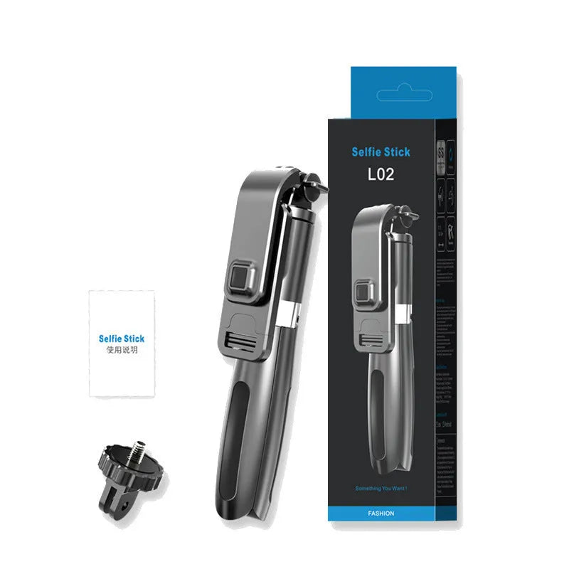 Black Bluetooth selfie stick extended to full length with phone attached, next to its wireless remote and tripod base.