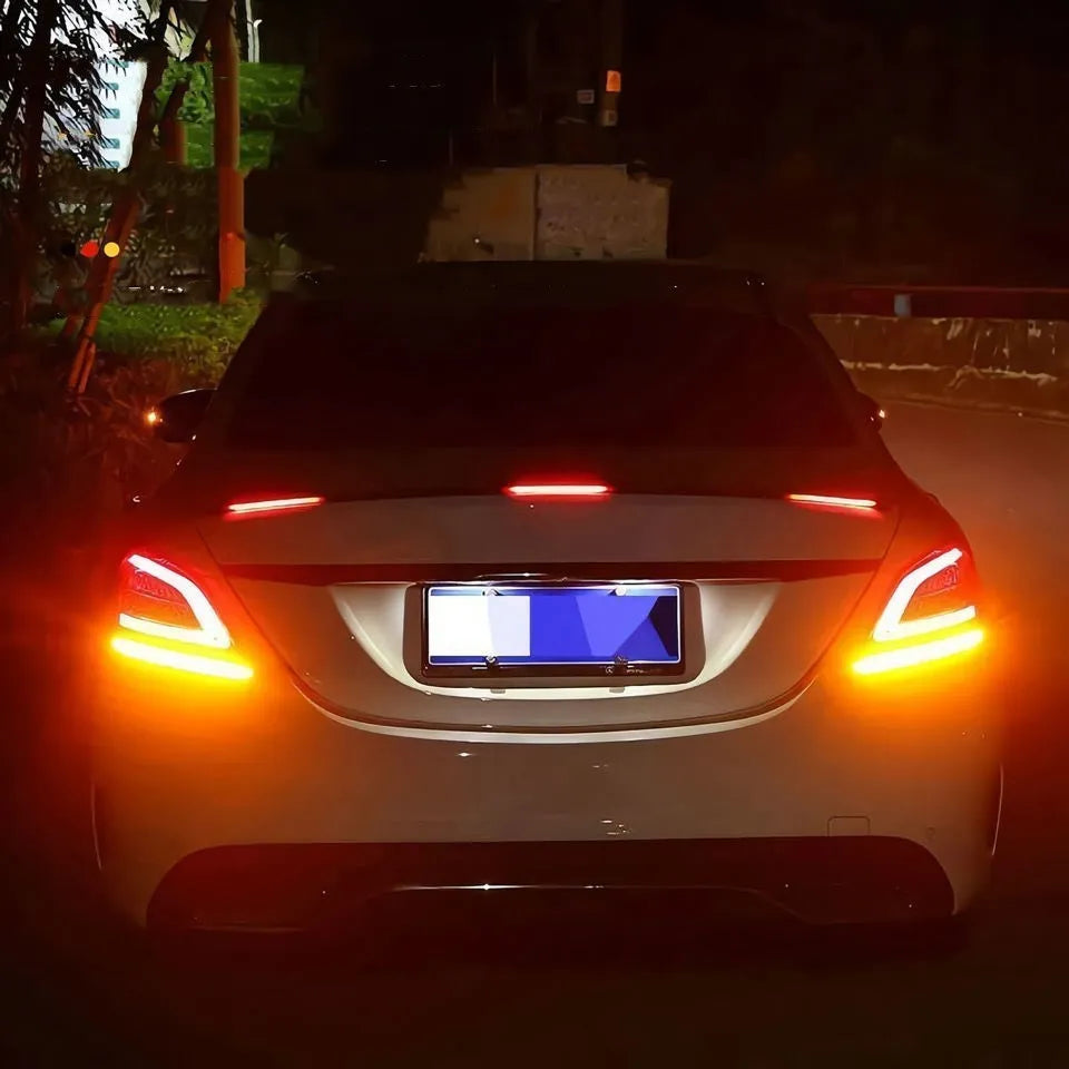Automobile LED streamer tail wing turn signal light kit showing installation on car rear