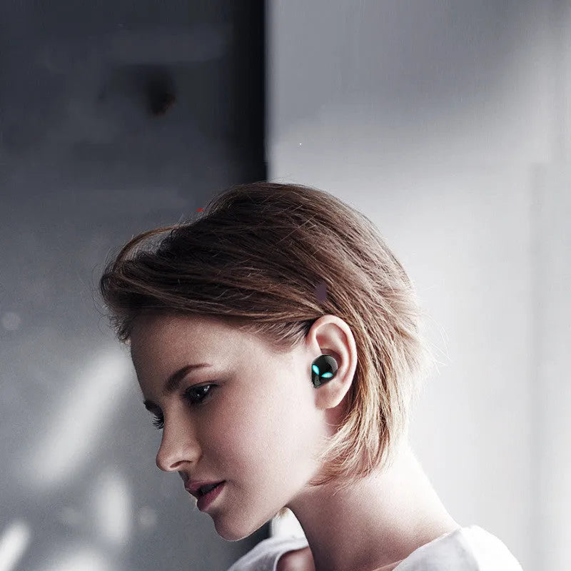 Creative Outer T8 Starman Bluetooth headset with alien design, wireless charging case, and 10mm speakers in black or white