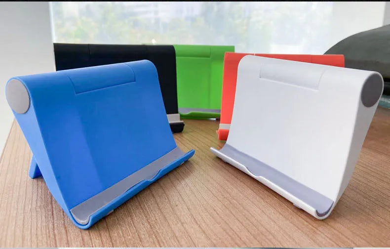 Black PE folding mobile phone stand holding tablet at 45-degree angle on wooden desk