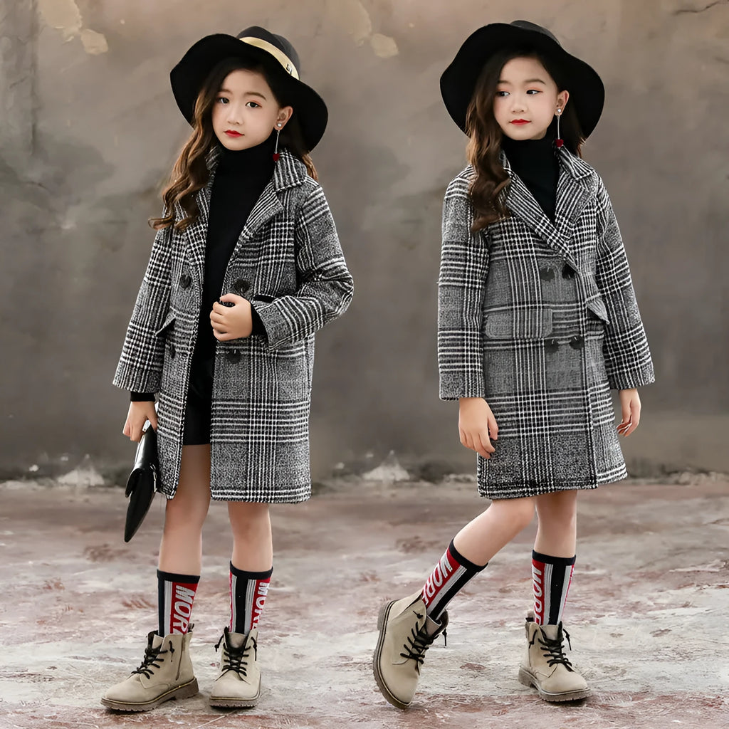 Girls grey and white houndstooth check coat with a suit collar and long sleeves.