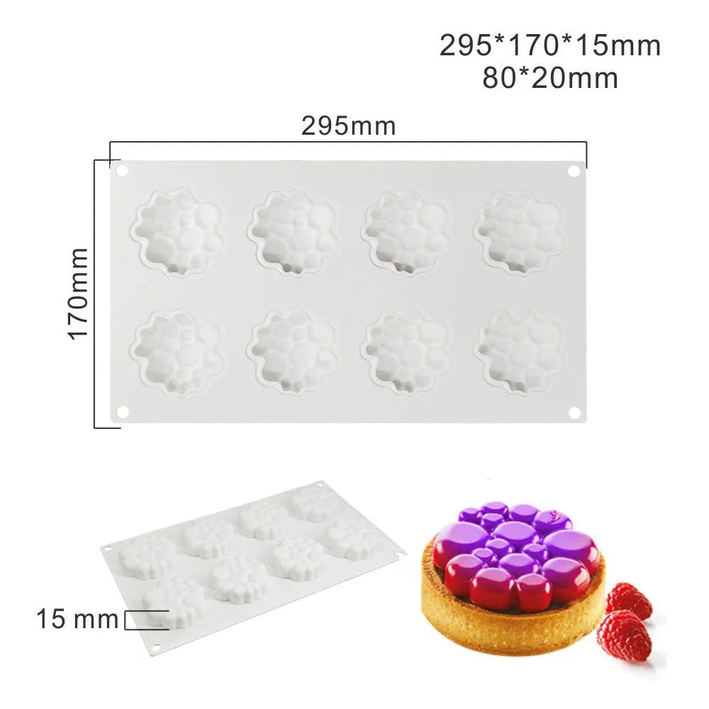 Round silicone cake mould with 8 bubble tower pattern design on a kitchen worktop.