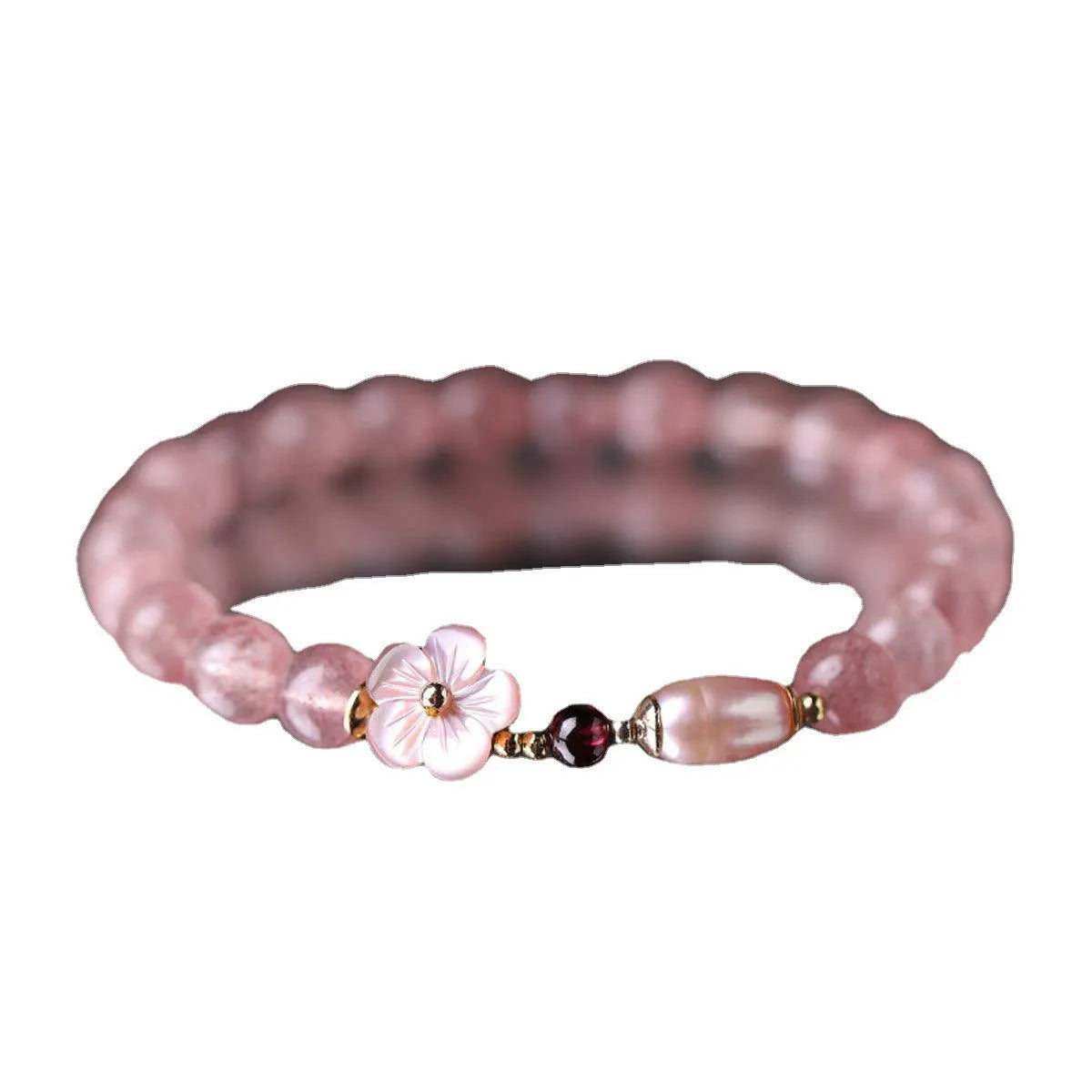 Strawberry quartz crystal bracelet with peach blossom floral design on wrist, showing adjustable 18-20cm length