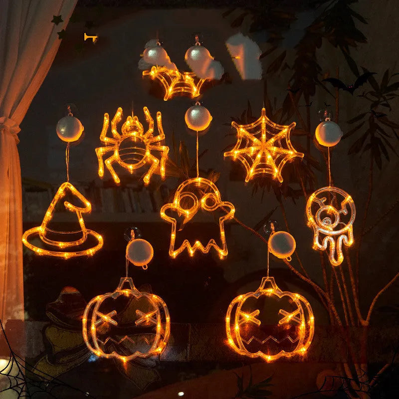 Halloween LED window lights set with spider, pumpkin and ghost designs on suction cups