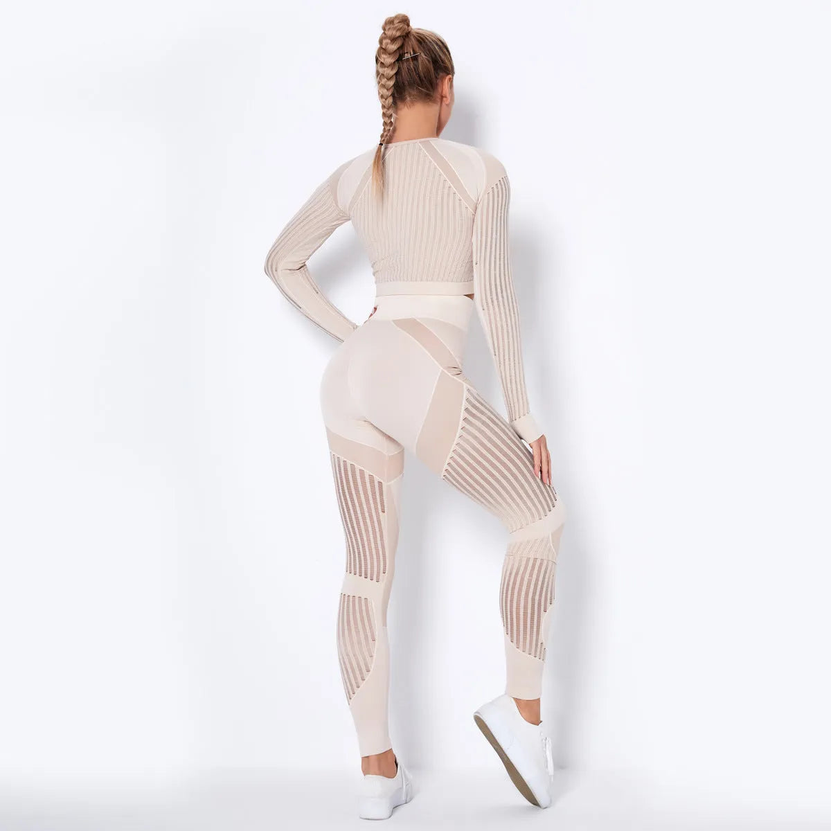Women's long-sleeved seamless yoga suit in a striped pattern, shown in a stretch fabric suitable for exercise.