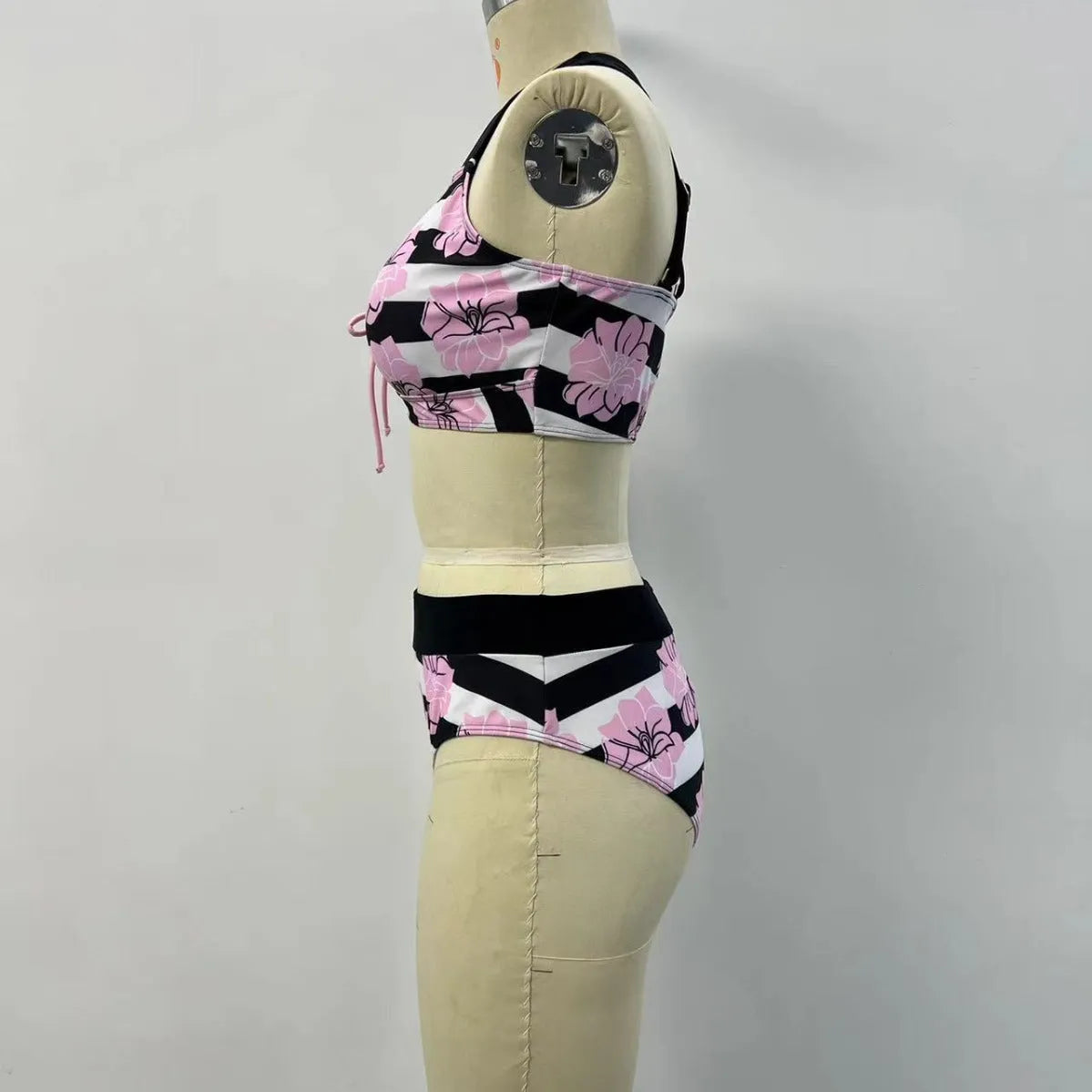 Black women's split bikini with belly-covered slimming design for swimming.