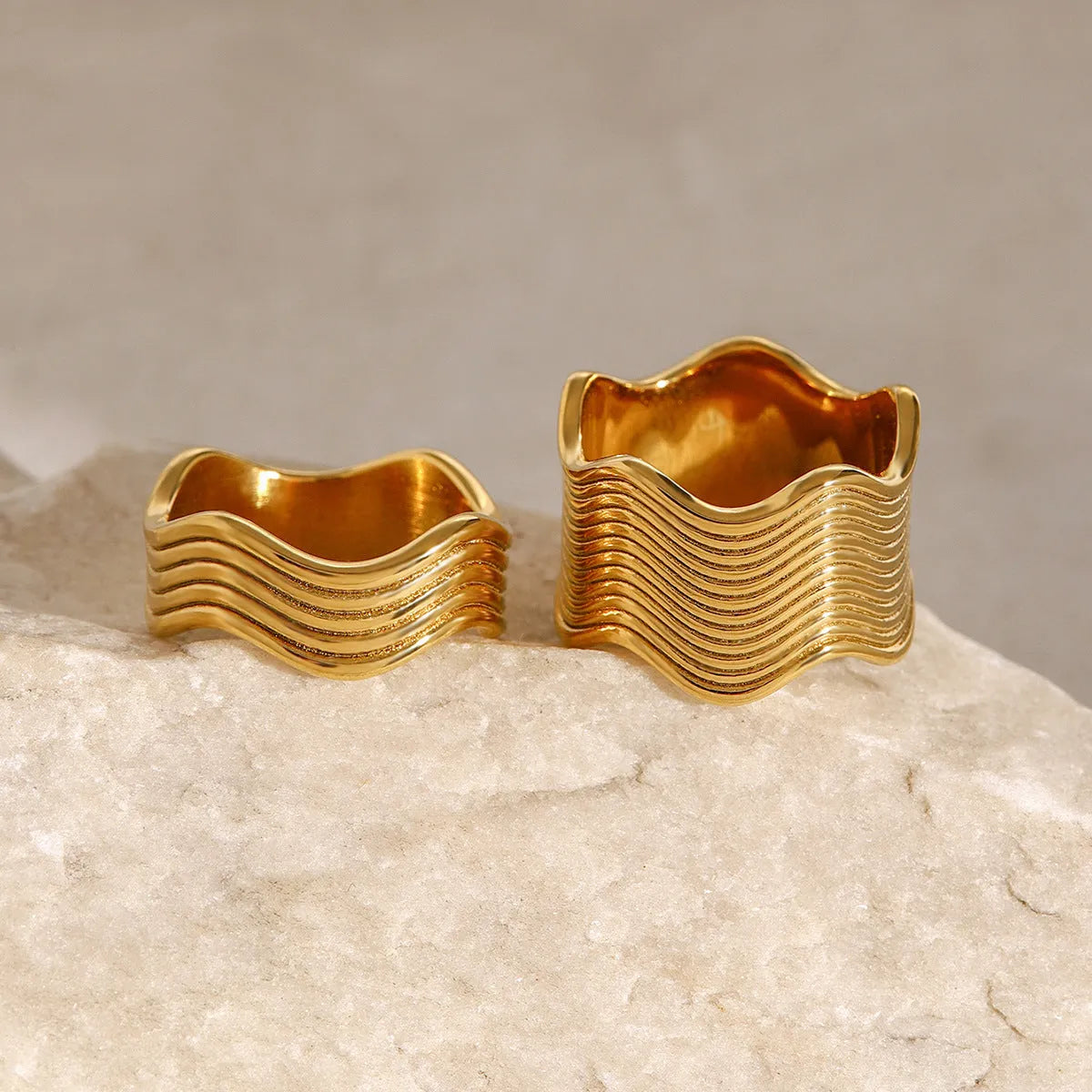 Stainless steel wide surface wave ring with geometric pattern and electroplated finish