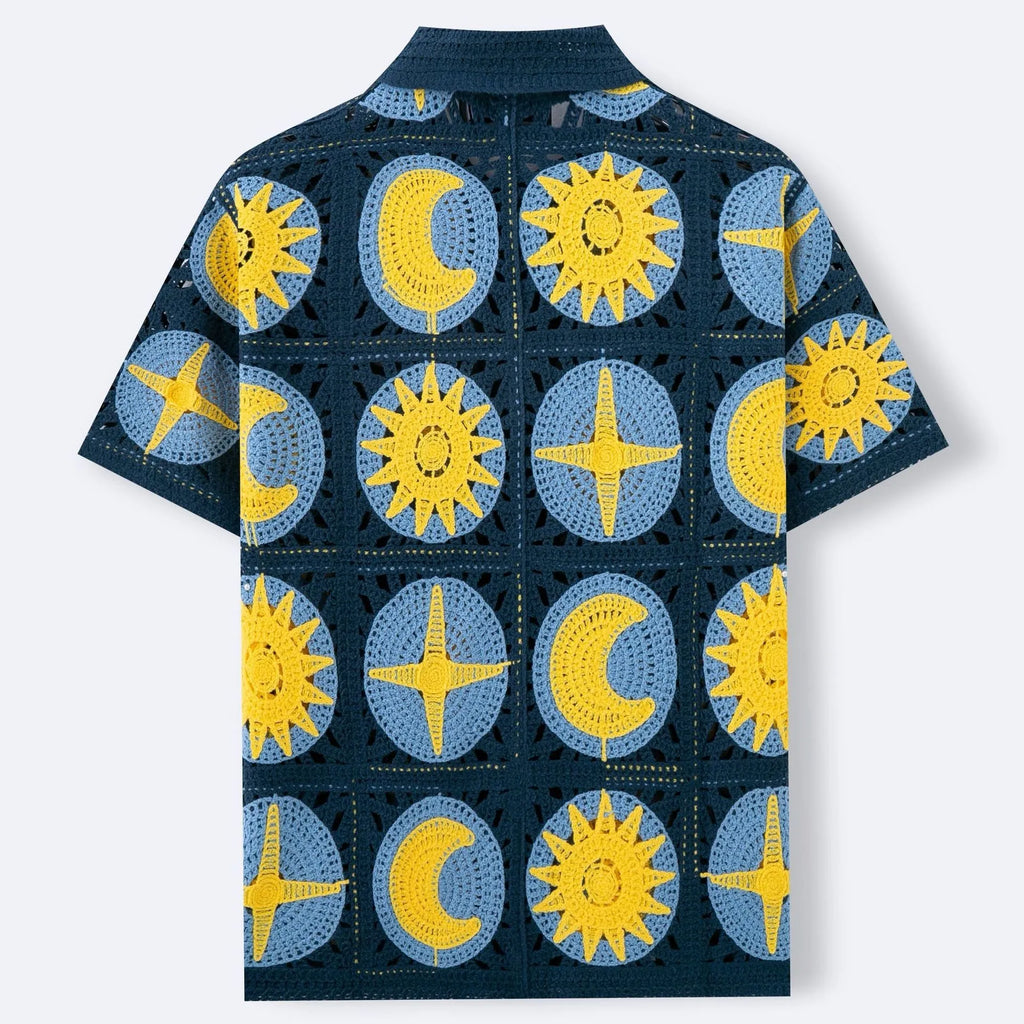 Navy blue men's short-sleeved cardigan with a cartoon flocking pattern, shown laid flat.