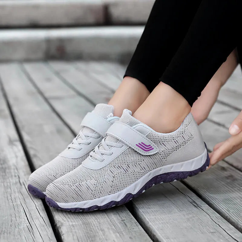 Women's low-top wedge shoes with Velcro strap and mesh upper in a solid colour